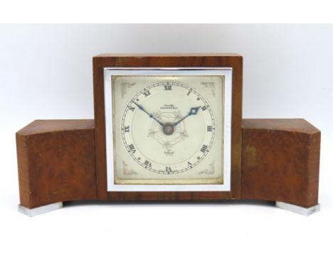 An art deco Elliott mantle clock with burr walnut finish retailed by Fillans, Huddersfield, 250mm wide x 129mm high x 75mm de