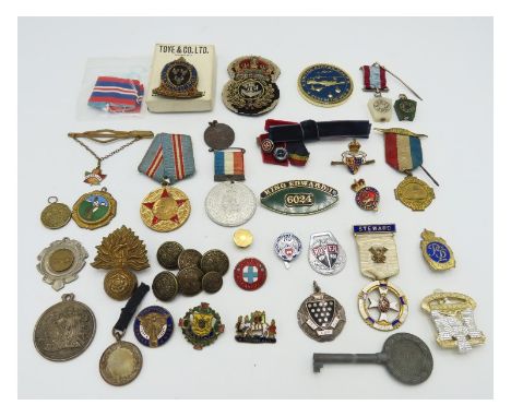 A selection of various badges & insignia including military, a Cornwall One And All, a silver masonic steward badge, green & 