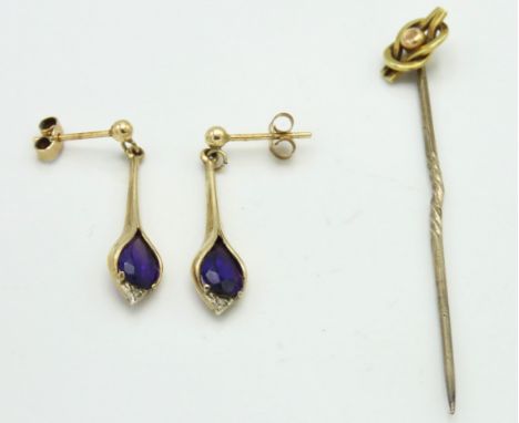 A 9ct gold tie pin, a/f twinned with a pair of 9ct gold mounted amethyst earrings, split to one ring attaching drop, 3.4g 