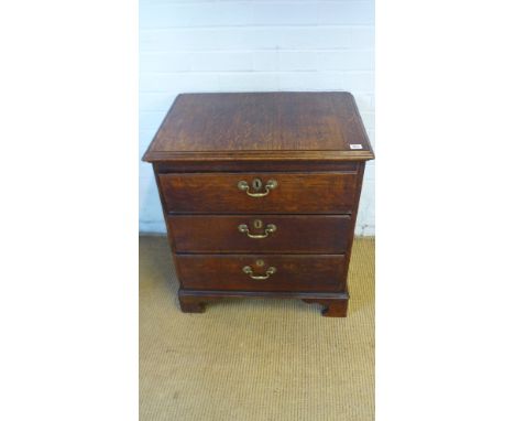 A small 18th century chest of three long drawers raised on bracket supports - Height 74cm x Width 64cm x Depth 34cm 