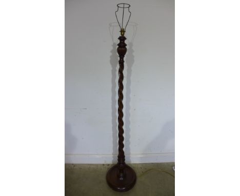 A George IV style mahogany floor lamp with rope twist support on a circular base - Height 156cm 