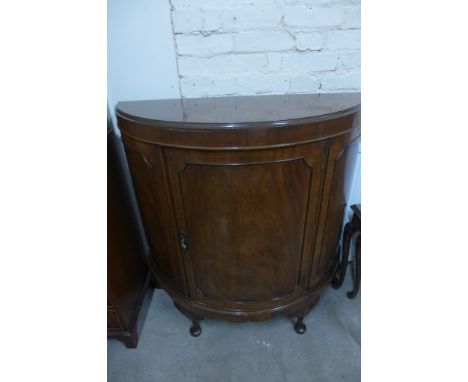 A Regency style bow fronted mahogany cabinet with single panelled door, shelved interior on cabriole legs - 107cm x 104cm x 4