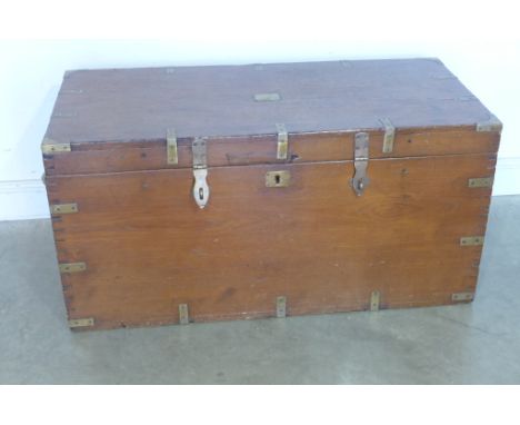 A 19th century teak brass bound trunk with lift up lid and twin side handles - 58cm x 117cm x 50cm 