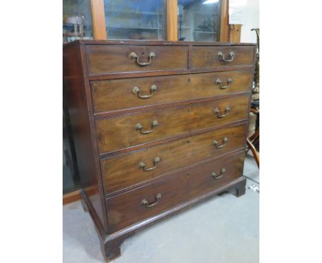 A Georgian mahogany chest with two short over four long drawers on a bracket feet - Height 109cm x Width 112cm x Depth 53cm 
