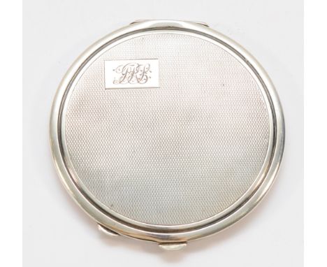 A silver compact, Birmingham 1940, with mirror but no powder, with engraved initials to the front, 9cm.