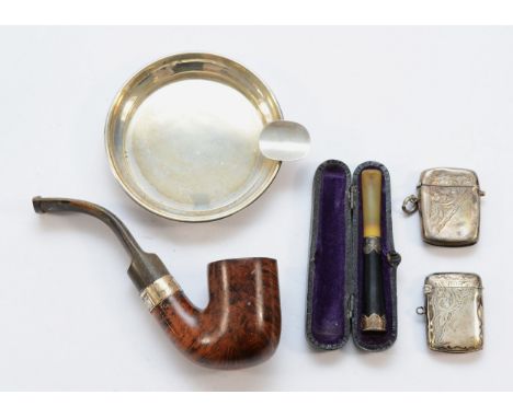 Two silver vesta cases, Birmingham 1905, 1942, together with a silver ashtray, Birmingham 1918, a silver decorated cigarette 