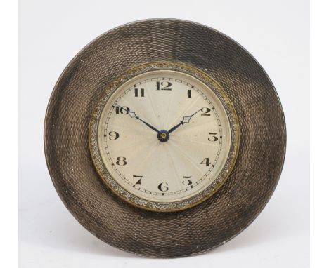 A silver framed desk clock, Birmingham 1931, with engine turned decoration, 8cm diameter, not working