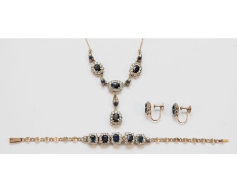 A pair of unmarked silver gilt sapphire screw back earrings, an unmarked silver gilt sapphire bracelet and an unmarked silver