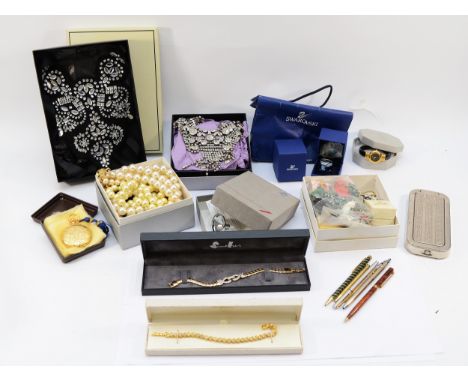 Estee Lauder, a pressed powder compact in the shape of a pocket watch, a Torq ladies fashion wristwatch, and a collection of 