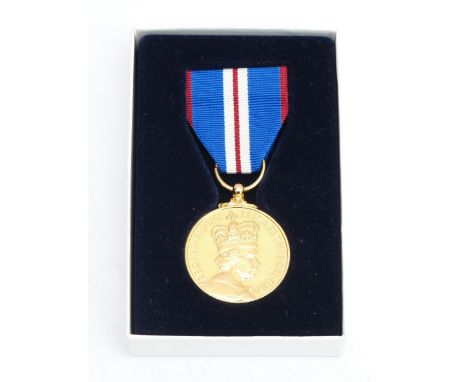 A boxed Elizabeth II Golden Jubilee medal.