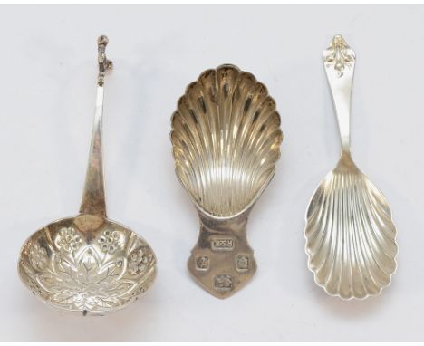 A silver shell shaped caddy spoon, London 1974, together with another shell shaped caddy spoon, Sheffield 1967, and a silver 