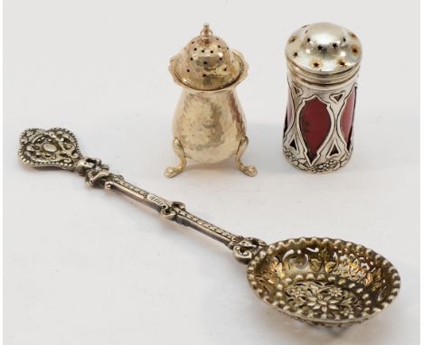 A Victorian silver pierced serving spoon 1866, together with a silver hammered pepper pot, Birmingham 1905, and a silver and 