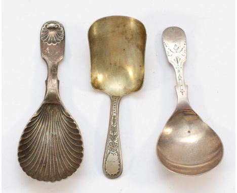 A silver shell shaped caddy spoon, Sheffield 1900, together with two other silver caddy spoons,