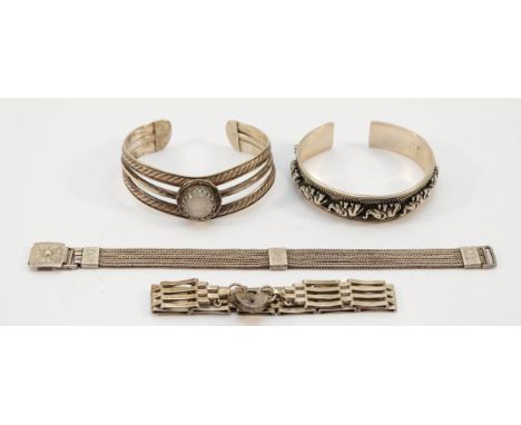 Two 925 silver cuff bangles, a silver gate link panel bracelet with a heart padlock clasp, and a 925 silver chain bracelet, 9