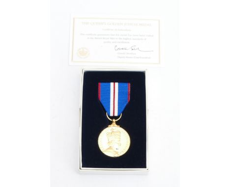A boxed Elizabeth II Golden Jubilee medal.