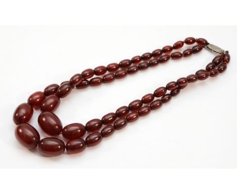 A sterling silver clasped double row of graduated cherry Bakelite beads, largest bead 28mm, 73g