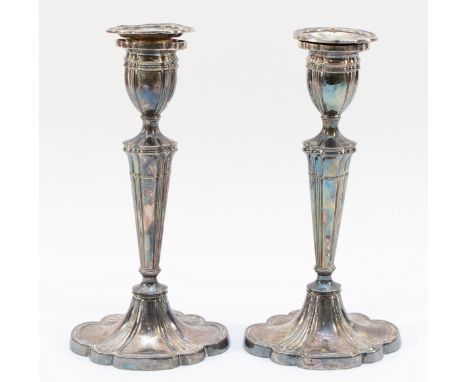 A pair of silver fluted candle sticks, London 1973, with detachable sconces, 22cm. In overall good condition.They stand strai