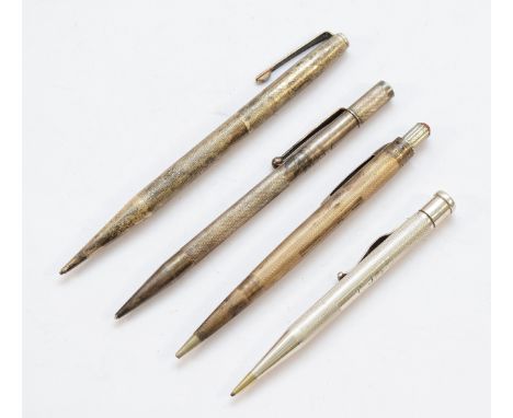Three silver twist action pencils, Birmingham 1942, 1947, London 1954, together with another sterling silver example.