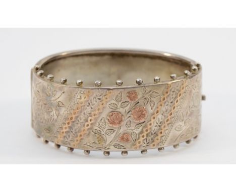A Victorian silver Aesthetic Movement hinged bangle, Birmingham 1883, 58mm, 35g Condition-The inside measurement of the bangl