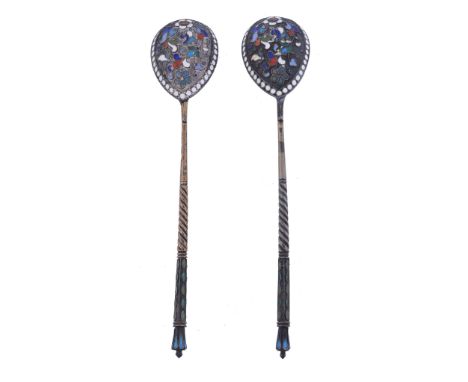  Two Russian silver and enamel spoons,   1908-26 Kokoshnik marks for Moscow, one parcel gilt, with flowers and foliage to the