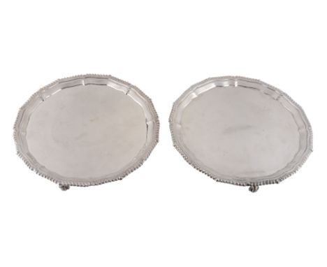  A pair of silver salvers by C. J. Vander,   Sheffield 1993, with shaped and gadrooned borders and on three scroll feet,  21c