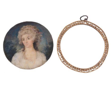  English school, circa 1800,   portrait of a lady in a white dress, 6.3cm diameter, with a gilt metal filigree frame 