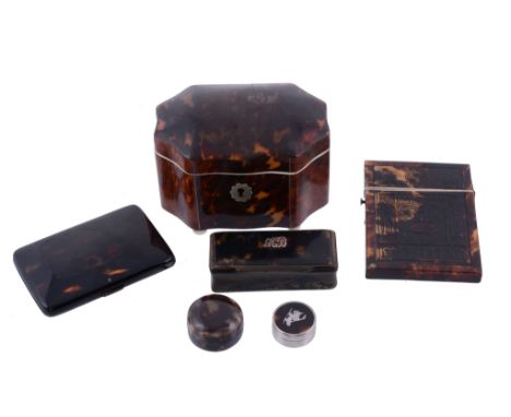  An early Victorian tortoiseshell canted-rectangular tea caddy,   with ivory opening edges and ball feet, 8cm (3 1/8in) high;