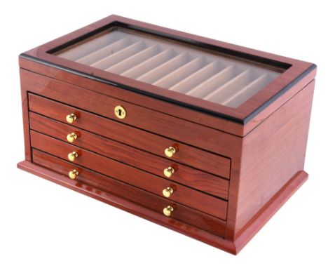  A brown lacquer pen cabinet,   with a glazed cover above four draws, 37cm long, 23cm deep, 19cm high 