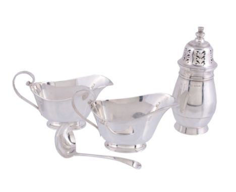  A pair of silver sauce boats by Goldsmiths  &  Silversmiths Co. Ltd  , London 1937, with scroll handles and on oval feet, 14