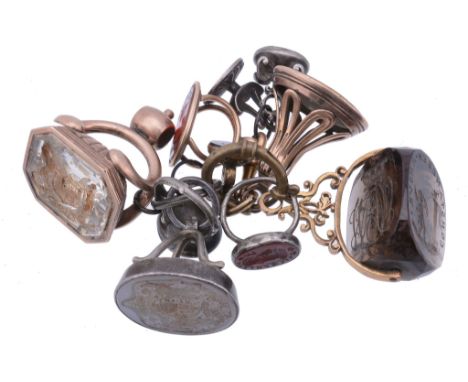  A group of ten fob seals,   mainly 19th century, including: three gold examples, all unmarked, one with a coat-of-arms of th