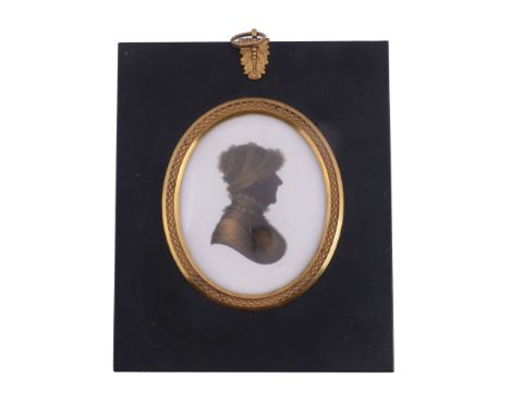  John Field (1772-1848) Silhouette portrait of a lady to the right Painted on plaster and bronzed 8cm (3 1/8in) high, oval In