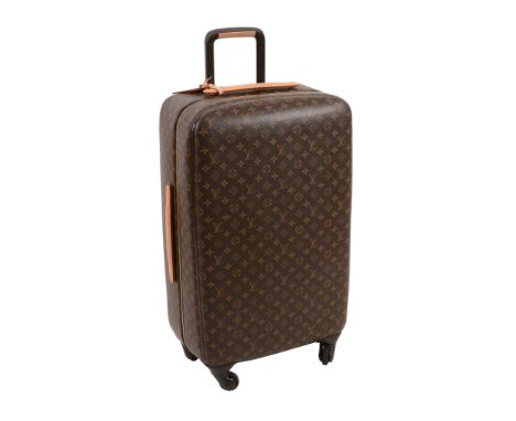  Louis Vuitton, Zephur, a large leather wheeled suitcase  , with all-over logo print, fitted a flat leather handle to top and