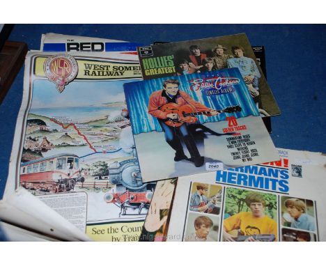 A quantity of LP records to incl 'Eddie Cochran', 'The Hollies' together with a quantity of 45's incl 'The Rolling Stones' an