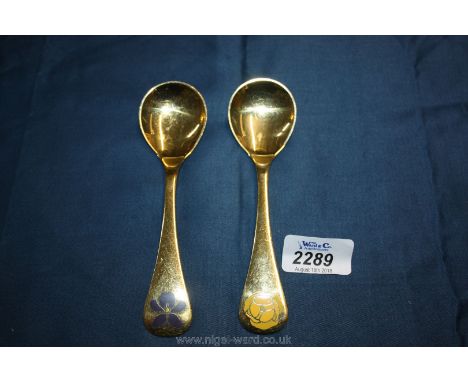 A pair of Georg Jensen Silver gilt and enamel Spoons with floral decoration