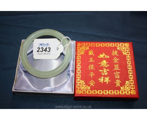 A presentation boxed Jade Bangle, 3" diameter, 2 1/4" internal diameter.