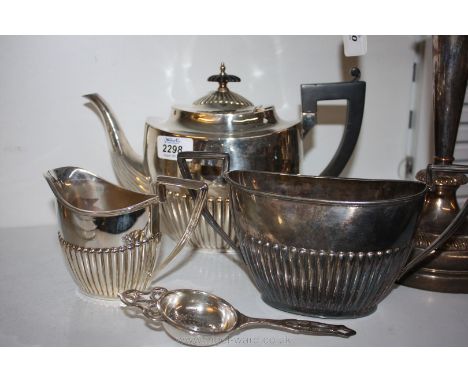 A three piece Walker & Hall plated Tea service and tea strainer
