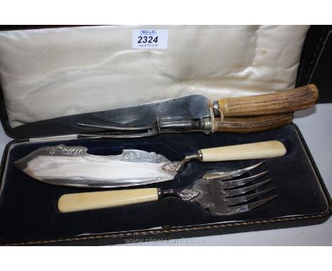 A pair of fish servers in case an a carving knife and fork with antler handles