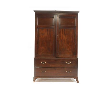 A Regency mahogany press cupboard, early 19th century, the upper section with panelled doors opening to reveal drawers within