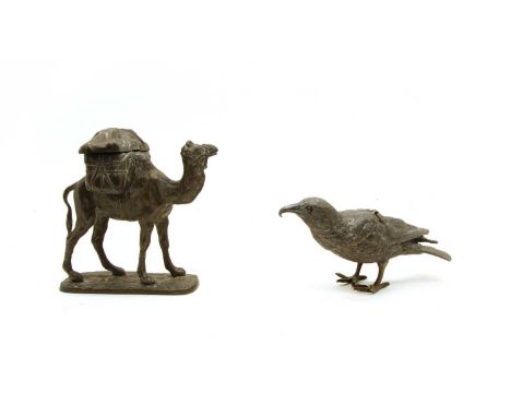 A cast metal inkwell, in the form of a camel with a pack, the hinged top revealing two wells, no inkwells, 14.5cm high, and a