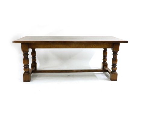 An oak refectory table, late 20th century, by Brights of Nettlebed, the removable rectangular top above ring turned and balus