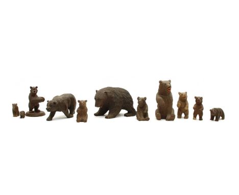 A collection of ten small Black Forest and other carved wooden bears, early 20th Century, the largest 13cm high (10)Condition