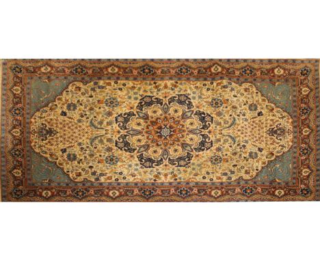 A small Persian Tabriz rug, century, woven with dense floral and foliate motifs, on an aquamarine ground, 160 x 93cm, and a s