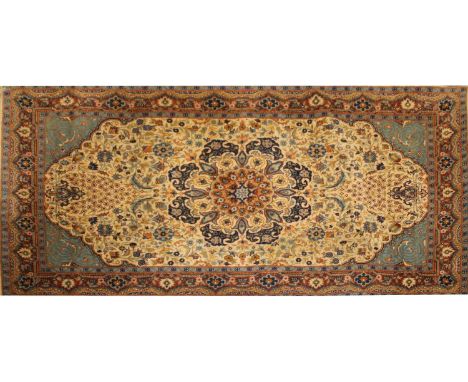 A small Persian Tabriz rug, century, woven with dense floral and foliate motifs, on an aquamarine ground, 160 x 93cm, and a s