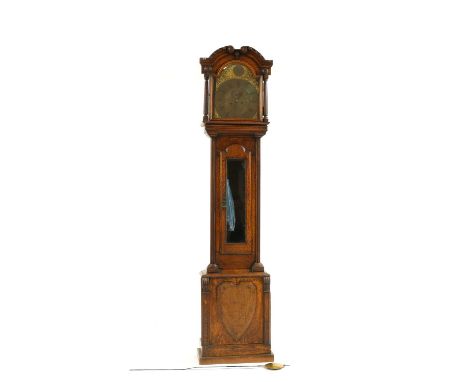 An oak cased longcase clock, with eight day movement to an arch top brass dial, 49cm wide, 29cm deep, 226cm highCondition rep