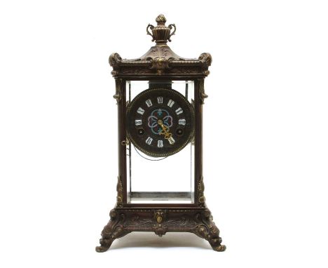 A cast four glass mantel clock, with an enamelled dial and numerals, with a mercury pendulum, 40.5cm highCondition report: Mo