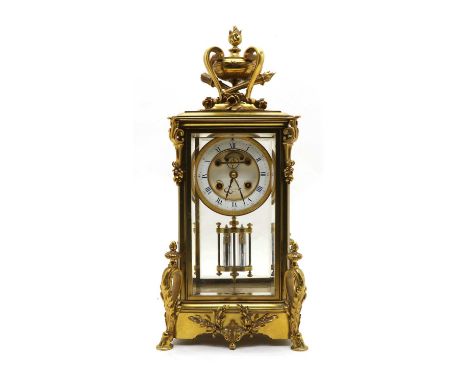 A late 19th century ormolu glass mounted mantel clock, dial signed W. Litherland Paris decorated with scrolled hoof feet and 