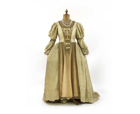 A Victorian style evening ball gown, in cream and gold, with laced corset top section, with faux pearl and gold tone detailin