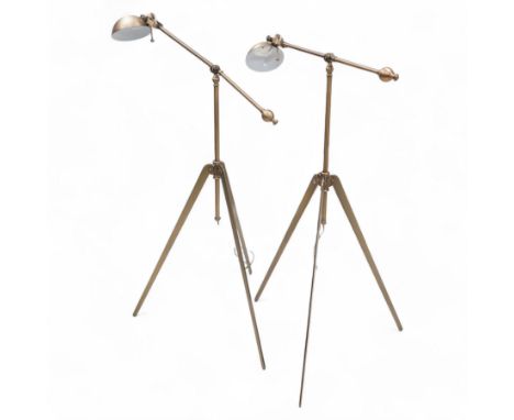 Two burnished metal adjustable tripod standard lamps