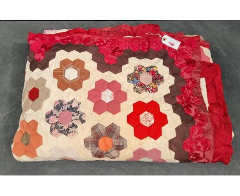 A large patchwork double quilt. 
