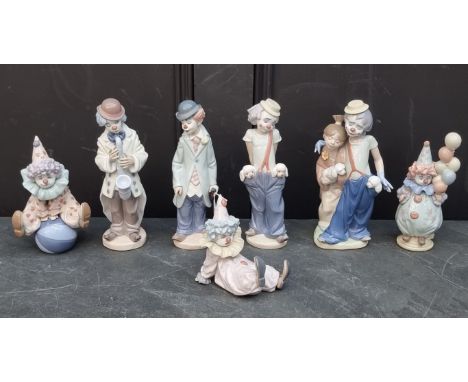 Seven Lladro clowns, largest 23cm high.
